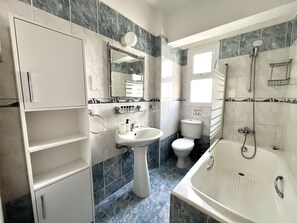 Bathtub, hair dryer, towels