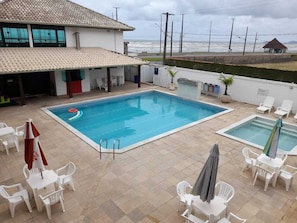 2 outdoor pools, open 8:00 AM to 10:00 PM, pool umbrellas