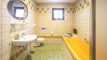 Bathtub, hair dryer, towels