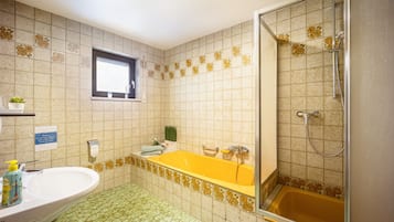 Bathtub, hair dryer, towels