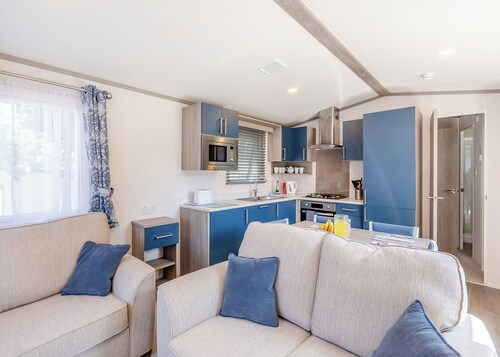 Spacious and luxurious 12ft-wide caravan with one double and one twin.