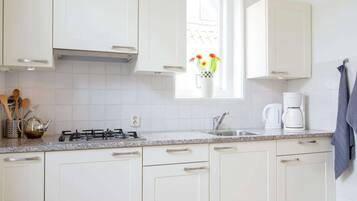 Fridge, microwave, highchair, dining tables