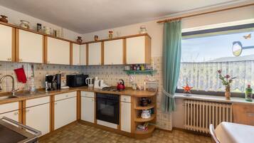 Fridge, oven, coffee/tea maker, dining tables
