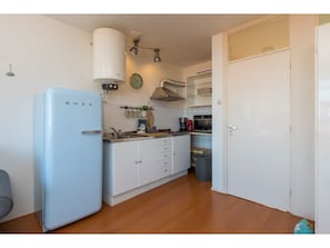 Fridge, microwave, stovetop, coffee/tea maker