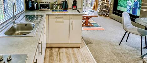 Oven, dishwasher, coffee/tea maker, dining tables