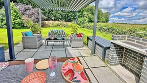 Terrace/patio - Recently upgraded with Gazebo over hot tub and side bar with stools. (Raywell, Beverley)