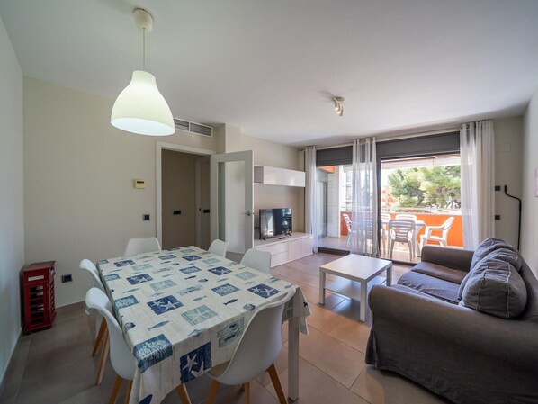 TV - 3-Bedroom Apartment with Pool, Terrace & Parking, 150m from Beach in Torredembarra, Spain (Torredembarra)