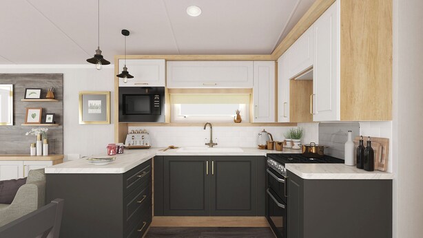Een moderne keuken met donkere kastjes, een witte werkblad, een ingebouwde magnetron, een fornuis en een spoelbak.