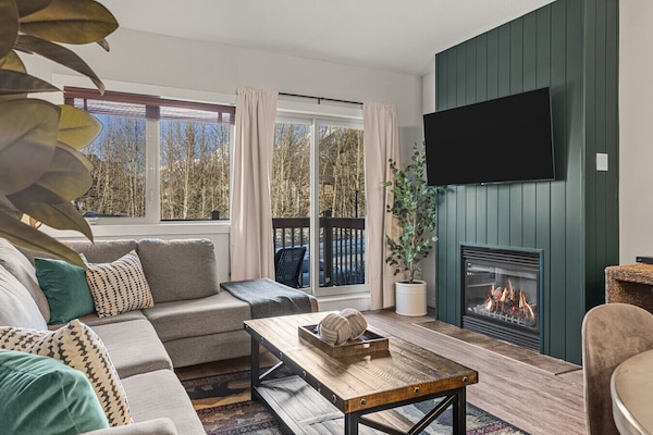 Surrounded by nature with soft forest green hues throughout make the unit feel warm and inviting
