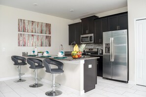 Fridge, microwave, oven, stovetop - 5 BR At ChampionsGate resort with private pool and resort amenities near Disney! (Davenport)