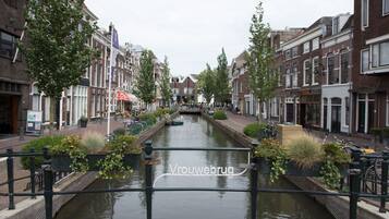A canal in a European town with traditional buildings on either side.