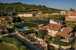 Traditional homes with pitched roofs and well-manicured gardens line the streets.