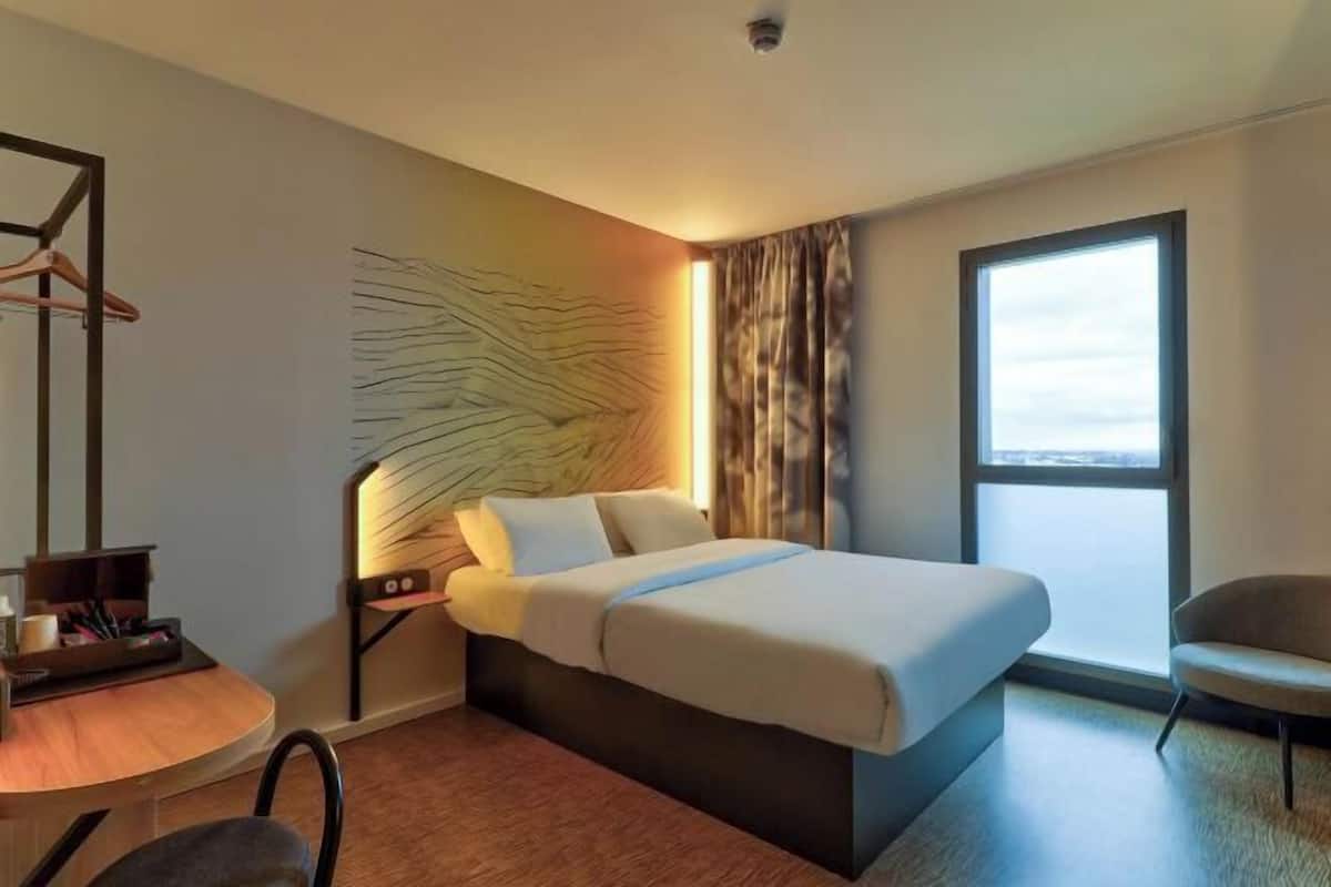 Premium bedding, desk, laptop workspace, blackout curtains