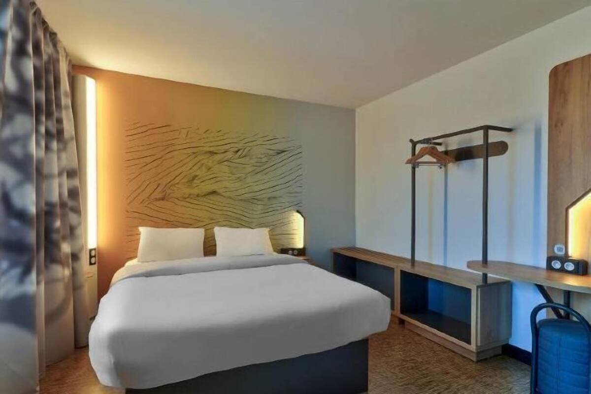 Premium bedding, desk, laptop workspace, blackout curtains