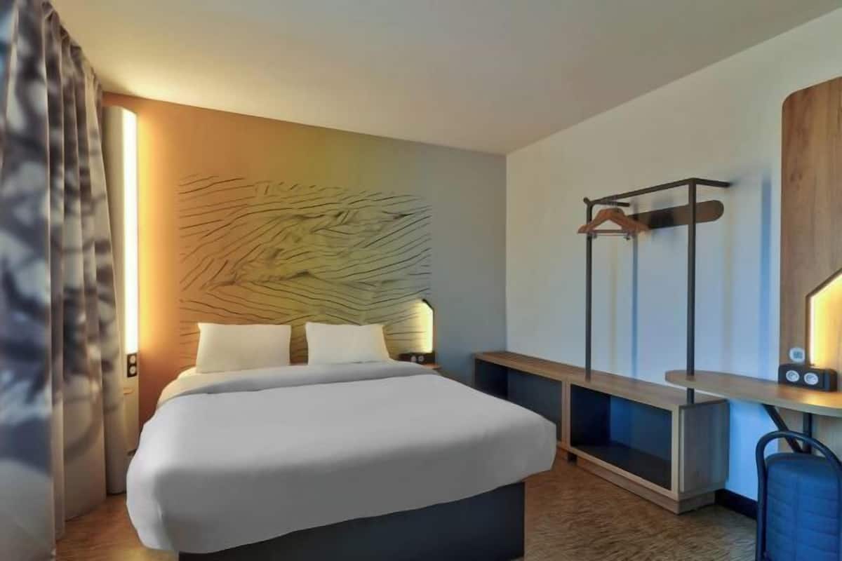 Premium bedding, desk, laptop workspace, blackout curtains