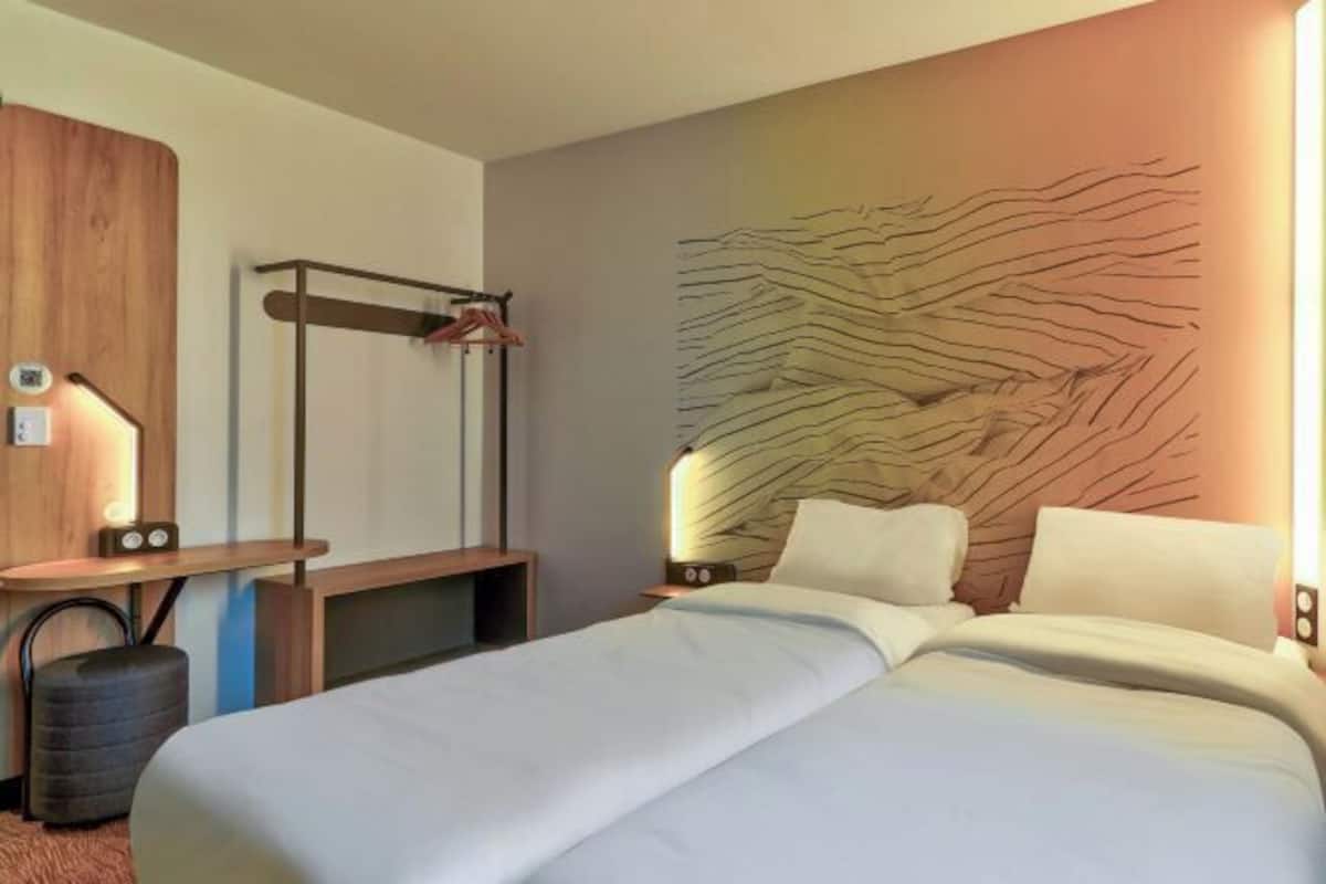 Premium bedding, desk, laptop workspace, blackout drapes