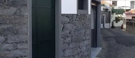 A building with a stone facade and a number '22' on the door.