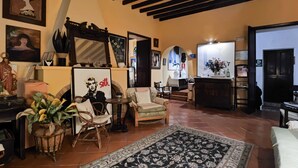 A cozy living room with a fireplace, comfortable seating, and various decorative items. - Apartment 'Navila Numero 2' with Shared Pool, Wi-Fi and Air Conditioning (Eivissa)