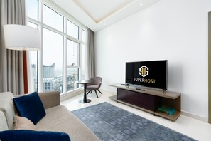 Apartamento design | Área de estar | Smart TV 55 polegadas com canais a cabo, TV