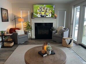 Smart TV, fireplace, books