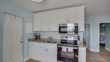 Fridge, microwave, stovetop, coffee/tea maker