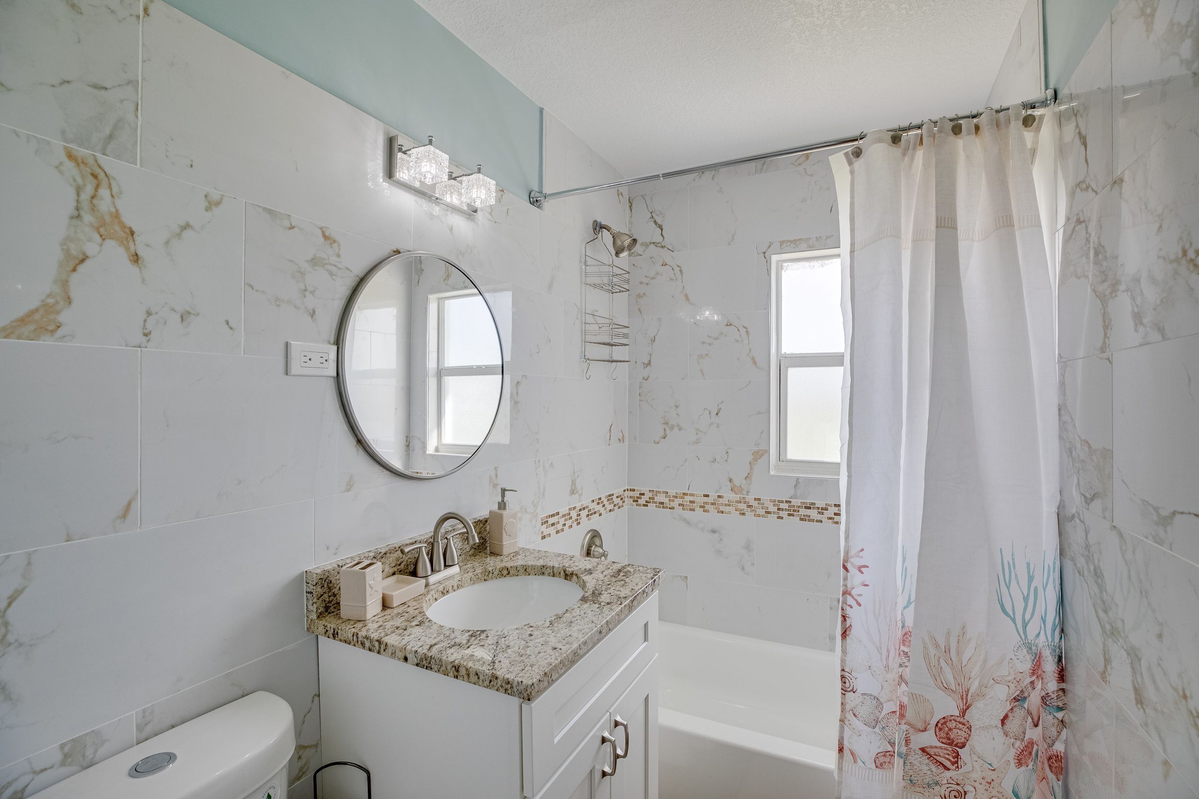 Hair dryer, towels, shampoo, toilet paper