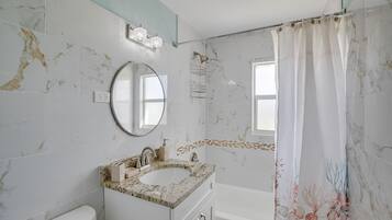 Hair dryer, towels, shampoo, toilet paper