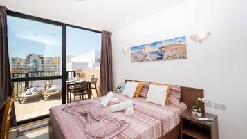 Standard Apartment, 1 Bedroom, Partial Ocean View | 1 bedroom, desk, laptop workspace, blackout curtains