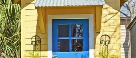 A charming single-story building with a gabled roof and a welcoming entrance.