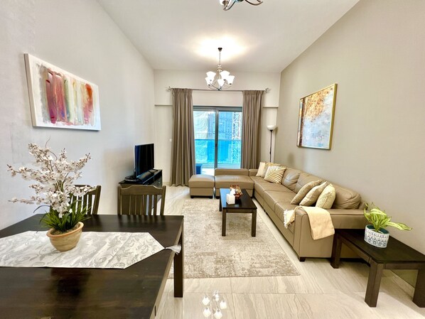 Design Apartment | Living area | 55-inch Smart TV with cable channels, TV - SuperHost - Spacious Apartment In Business Bay With Canal View (Dubai)