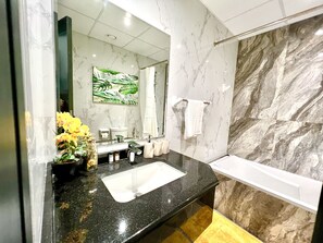 Design Apartment | Bathroom | Bathtub, hair dryer, towels, shampoo - SuperHost - Spacious Apartment In Business Bay With Canal View (Dubai)