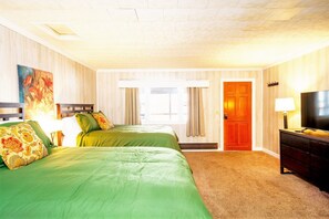 A hotel room with two beds, a TV, and a door leading to another room. - Secluded Lodge w/ grill + Free Coffee and Tea (Elkins)