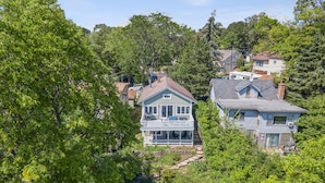 A residential area with houses surrounded by dense greenery.