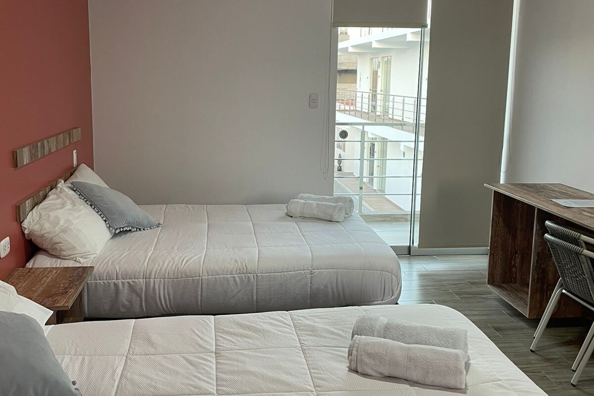 Premium bedding, down comforters, desk, laptop workspace