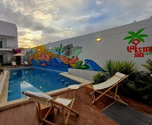 Outdoor pool, pool umbrellas, sun loungers