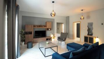 Family Condo | Living area | 50-inch Smart TV with cable channels, Netflix, streaming services