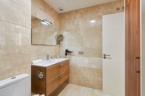 Shower, hair dryer, towels, soap