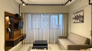 Classic Studio | Living area - SOL - Flats Av Cauaxi By Anora Spaces (Barueri)