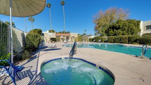 A pool area with lounge chairs, a hot tub, and palm trees. - 2 Mi to Old Town: Home w/ Pool Access & Patio (Scottsdale)