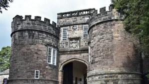A historic stone castle with a central arched entrance, flanked by two round towers. - 3 bedroom accommodation in Broughton, near Skipton (Broughton, near Skipton)