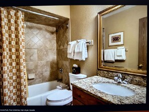 Hair dryer, towels, soap, shampoo