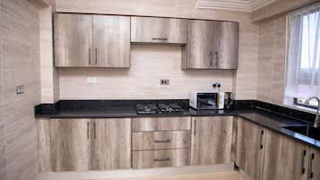Apartemen | Dapur pribadi | Lemari es, microwave, dan ketel listrik