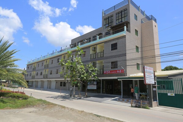 A multi-story building with a sign for 'Rujia Condotel & Spa'. - RUJIA CONDOTEL CORP. (Lapu-Lapu)