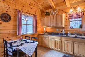 Dining - Quaint cabin nestled in the pines. (Logan)