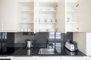 Fridge, microwave, oven, stovetop - Dreamy Wiedikon 2.5 Room w/ Storage & W/D, 3 min to Market, by Blueground (Zurich)