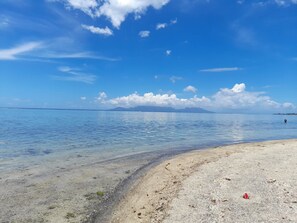 On the beach, sun-loungers, beach towels