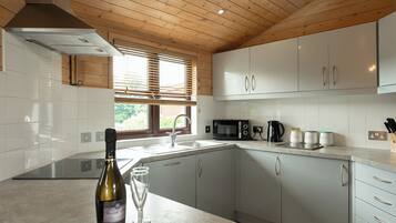 Oven, dishwasher, coffee/tea maker, dining tables