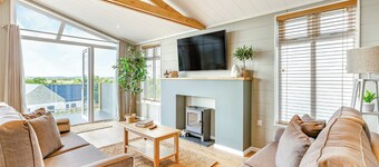 Luxurious lodge with vaulted ceilings and a welcoming feature fireplace.