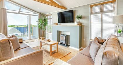 Luxurious lodge with vaulted ceilings and a welcoming feature fireplace.
