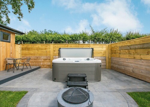 Luxurious lodge with vaulted ceilings and a welcoming feature fireplace.